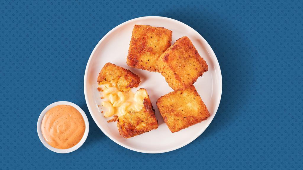 Classic Mac Bites​ · Four golden-fried mac & cheese bites served with Awesome sauce for dipping