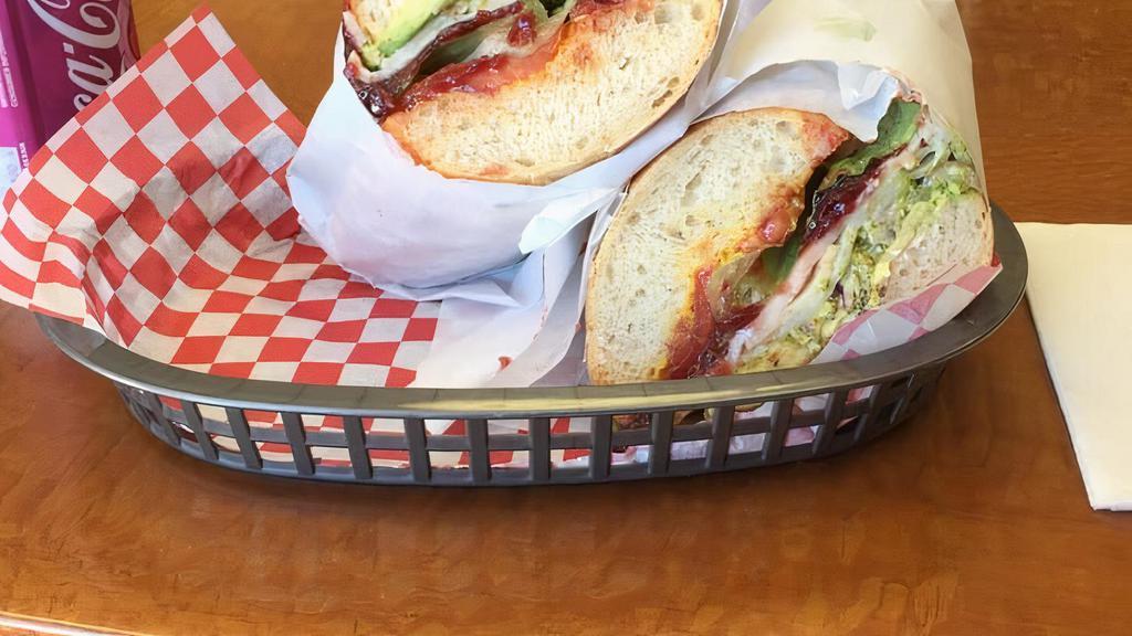 Roasted Turkey with Bacon Ultimate Sandwich · Popular item. Monterrey jack cheese, mayonnaise, mustard, lettuce, tomatoes, onions and pickles.