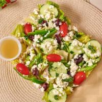 Greek salad · Lettuce,Onions,Grape Tomatoes,
Kalamata Olives,Feta Cheese, Cucumbers, Bell Peppers.
