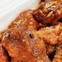 Wings 6 pcs Bone in  · Bone in chicken wings teriyaki garlic served with spicy sauce