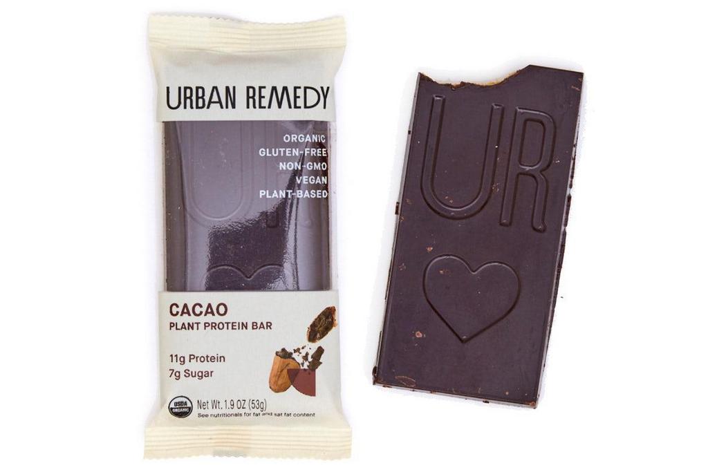 Cacao Plant Protein Bar · An Urban Remedy favorite, our plant-based protein bar converts healthy fats into all-day energy. Made with cacao, flax seeds, almond flour, coconut, vanilla, cinnamon, and Himalayan pink salt, this slightly sweet treat is your morning jumpstart or your afternoon reviver—it’s also a great addition to your pre or post workout regimen.. All of our products are organic, gluten-free, dairy-free, and non-GMO.. INGREDIENTS. Cacao Butter*, Pea Protein Powder*, Coconut Oil*, Coconut Syrup* (Coconut Nectar*, Water), Flax Seed*, Almond Flour*, Cacao Powder*, Cocoa Bean*, Coconut Sugar*, Vanilla Extract*, Himalayan Pink Salt, Cinnamon Powder*, Stevia Extract*. CONTAINS: . Coconut, Almond. * ORGANIC