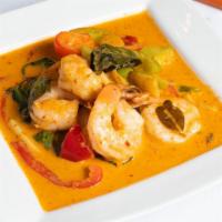 E5. Red Curry · Red curry with bamboo shoots, bell peppers, and basil cooked in coconut milk.