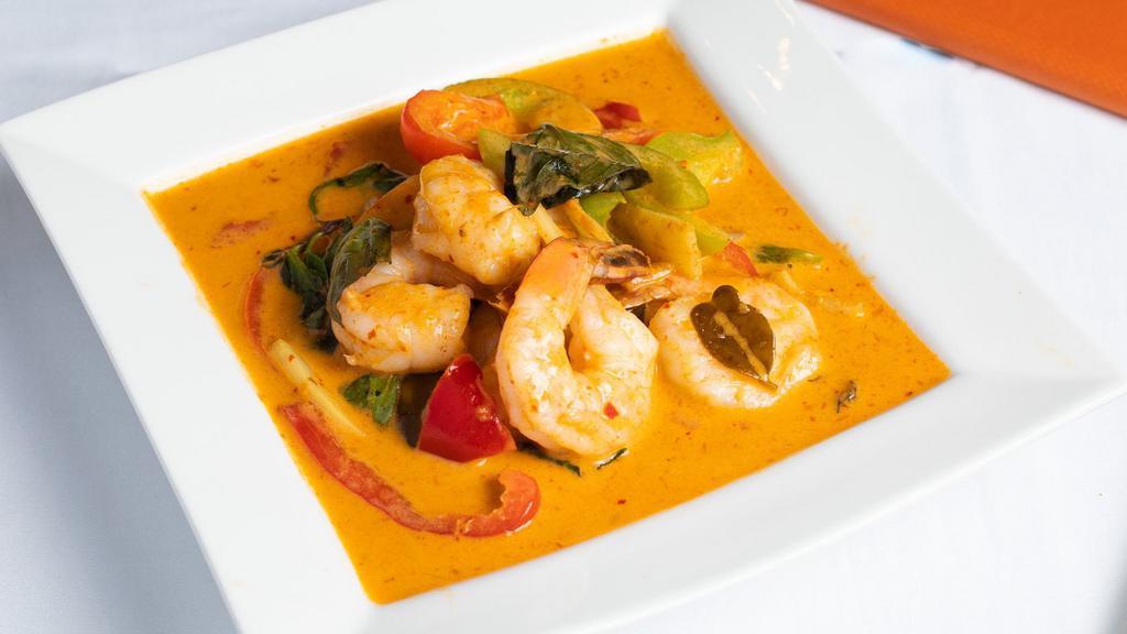 E5. Red Curry · Red curry with bamboo shoots, bell peppers, and basil cooked in coconut milk.