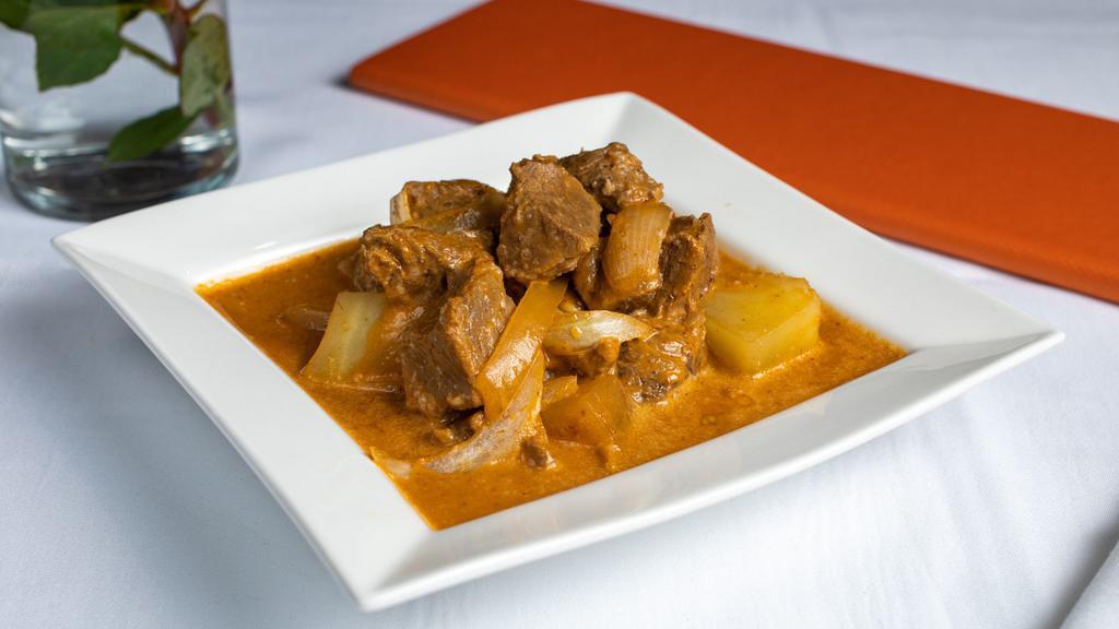 E1. Massaman Curry · Massaman curry with potatoes, onions, and peanuts cooked in coconut milk.
