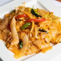 N13. Pad Kee Mao · Spicy pan-fried wide rice noodles with tomatoes, cabbage, onion, bell peppers, egg, garlic, ...