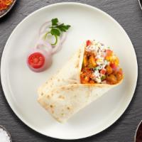 Paneer Tikka Minute Burrito · Paneer Tikka Masala Cubes wrapped in Naan with sauce, onions, tomato and lettuce.