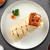 Butter Off Alone Chicken Burrito · Butter chicken served wrapped in naan with sauce, onions, tomato and lettuce.