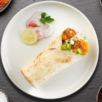 Saag Swag Paneer Burrito · Saag Paneer wrapped in naan with sauce, onions, tomato and lettuce.