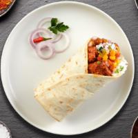 Chick Seekh Schick Burrito · Grilled chicken Seekh kabab wrapped in naan with sauce, onions, tomato and lettuce