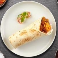 Lamb Of Keema Burrito · Spicy lamb Keema wrapped in naan with sauce, onions, tomato and lettuce.