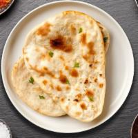 The Plain Naan · Freshly baked bread in a clay oven