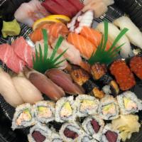 Sushi Boat B · A large assortment of sushi and sashimi that serves two. 16 pieces of nigiri, 11 pieces of s...