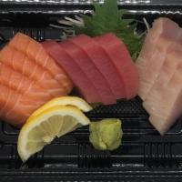 Sashimi Trio (12) · Four pieces each of tuna, salmon, and yellowtail.