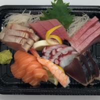 Deluxe Sashimi (19) · Assortment of tuna, salmon, yellowtail, white fish, octopus, bonito, and shrimp sashimi.