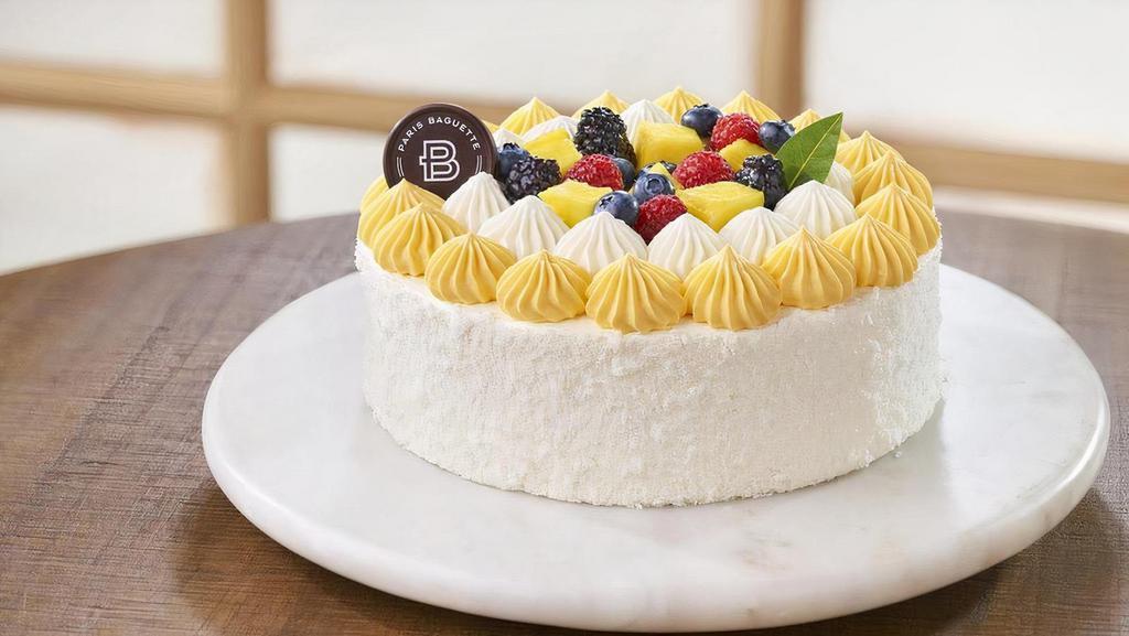 Tropical Mango Coconut Cake · 3 Layers of Vanilla Cake, Filled with Mango & Coconut Soft Cream, Covered with Coconut Flakes. Contains: Coconut, Egg, Milk, Soy, Wheat