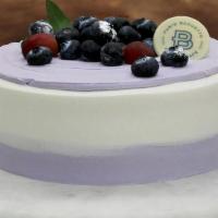 Blueberry Yogurt Cake · 3 Layer Vanilla Cake, Blueberry Yogurt Cream Filling with Strawberry. Contains: Egg, Milk, S...
