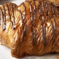 Chocolate Croissant · Butter croissant, dark chocolate filling, dark chocolate drizzle.

Contains: Coconut, Milk, ...