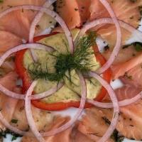 *Gravlax* · Thinly sliced Haus-Cured Gravlax with Capers, served with
Dill-Mustard Sauce