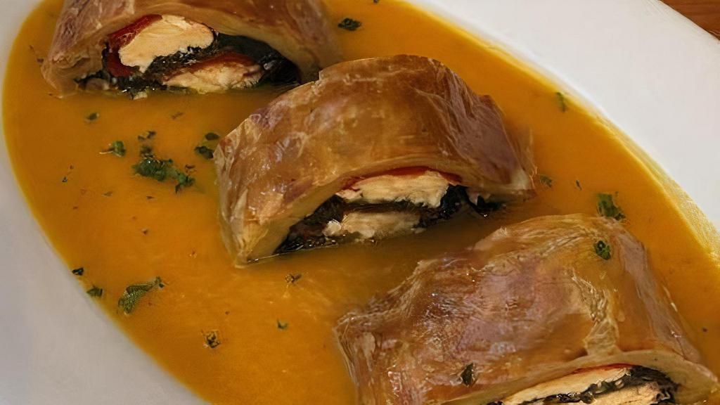 *Vegetable Strudel* · Spinach, Goat Cheese & Red Bell Peppers wrapped in Puff Pastry served over Carrot Purée