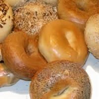 A Dozen Bagel Only · Vegetarian. Serves up to 4 gourmet bagels cheese topped or blueberry cinnamon raisin bagels....