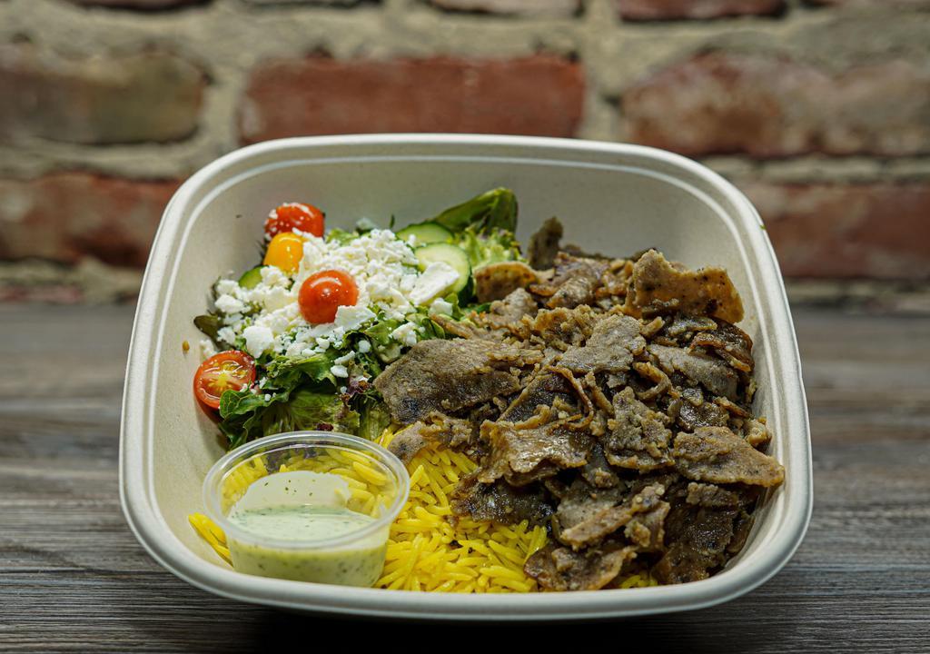 Lamb and Beef Gyro Rice Bowl · Gluten-free. House marinated  Lamb and Beef Gyro with healthy herbs and spices, rice, house salad, feta cheese, orange sauce, yogurt sauce.