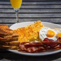 THE STANDARD · Two eggs any style, yukon gold hash browns, choice of pork sausage, chicken-apple sausage or...