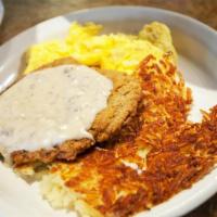COUNTRY FRIED STEAK AND EGGS · Country gravy, two eggs any style. Served with yukon gold hash browns and your choice of toast