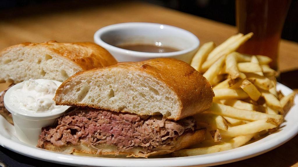 FRENCH DIP · House-Roasted top sirloin, thinly sliced, on warm french roll with au jus and creamy horseradish