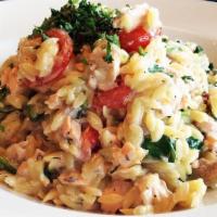 ORZO SALMON · Grilled salmon tossed with orzo pasta, cherry tomatoes, baby spinach, fresh dill, lemon, whi...