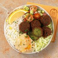 Falafel Rice Bowl · Crispy falafel over basmati rice with hummus, diced cucumber and tomato salad, shredded gree...