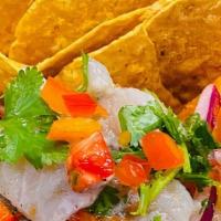 Tinta · Tender white fish marinated in lemon juice, cilantro, red bell pepper, and red onion . Tosse...