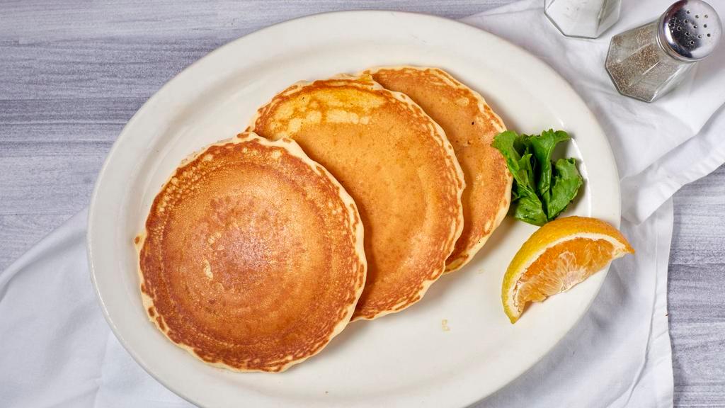 Full Stack Pancake · Three buttermilk pancakes.