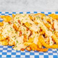 Guap Fries · Krinkle cut fries with our World Famous fried chicken spiced to your preference, cheese sauc...
