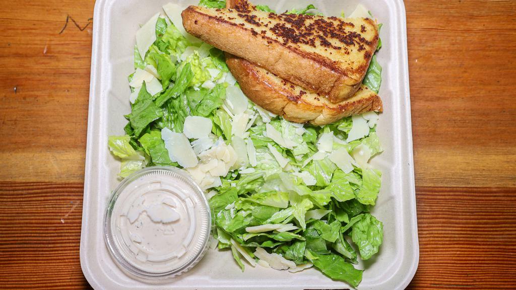 Full Caesar Salad · Large romaine lettuce salad tossed in creamy caesar dressing and shaved parmesan cheese. served with side of garlic butter toast.