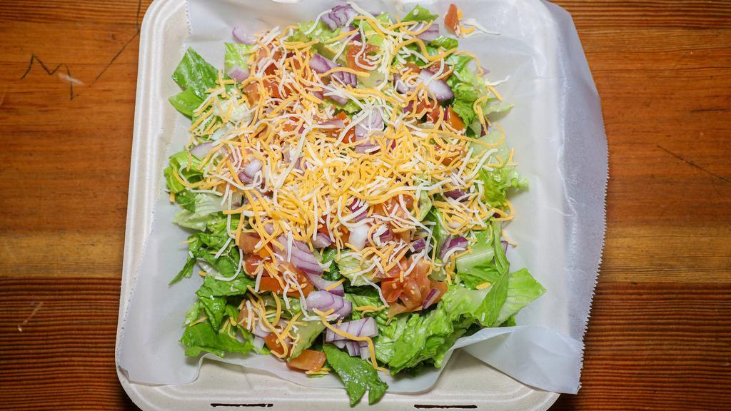 House Salad · Your choice of romaine, organic spring mix or spinach with tomato, cucumber, red onion, carrots and cheese.