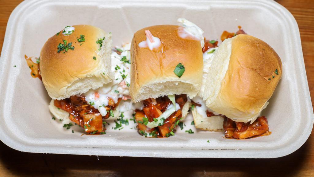 BBQ Chicken Sliders · All natural chopped chicken thigh topped with house made coleslaw served toasted bun.