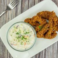 Organic Chicken Breast Strips · Marinated w in house seasonings battered and oven fried. served with side of house made cole...