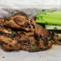 Jumbo Smoked Wings · Marinated in house seasonings and smoked to perfection. served with celery, sticks, and choi...