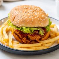 Fried Chicken Sandwich with Fries · Crispy battered chicken, lettuce, special sauce, tomato and creamy cheese on a homemade bun ...