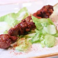 1. 新疆羊肉串 - XinJiang Lamb Kebab (Each) · Hot and spicy.