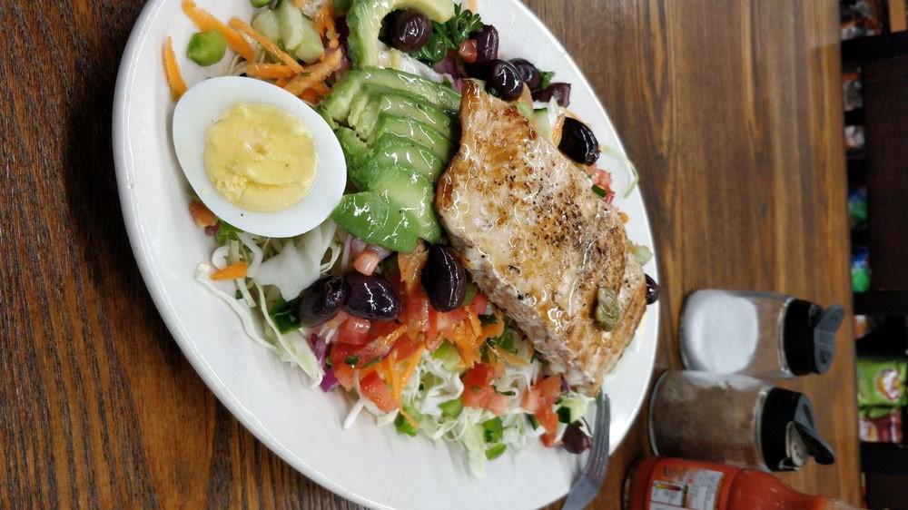 NICOISE  · ( TUNA SALAD OR SALMON ) SPRING MIX, BOILED EGGS, AVOCADO, CUCUMBER, TOMATOES, RED ONIONS,  BELL PEPPER IN A MIXTURE OF CAESAR & CITRUS VINAIGRETTE