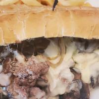 Basic Cheesesteak · Sliced steak with cheese wiz on a hoagie roll.