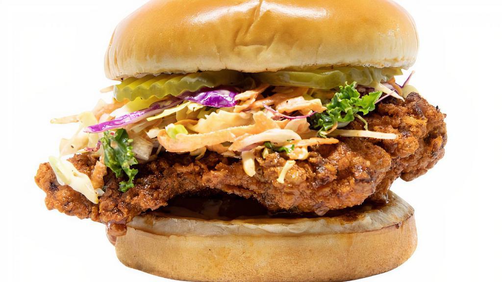 Nashville Hot Chicken Sandwich · Breaded chicken thigh with spicy mayo spread, chicken thigh tossed in our nashville sauce, coleslaw, and pickles