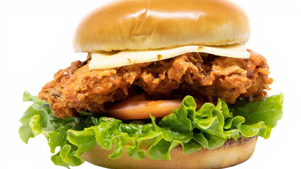 Buffalo Chicken Sandwich · Breaded chicken thigh with mayo spread, chicken thigh tossed in our buffalo wing sauce, lettuce, tomato, pepper jack cheese on brioche buns