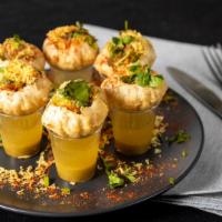 Pani Puri Shots · Hollow fried shells stuffed with potato, onion, and chickpeas. Served with a mixture of swee...