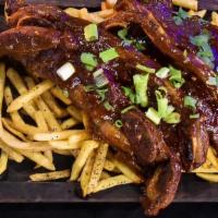 BBQ Ribs · Ribs marinated in homestyle tandoori BBQ sauce, served with side of fries.