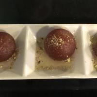 Gulab Jamun · Milk based fried dumplings topped over with syrup.