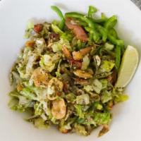 Tea Leaf Salad · Staple side salad in Burmese meals! Roasted Peanuts, Slices of fried garlic, fresh fava bean...