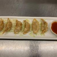 Crispy Chicken Gyoza · Deep fried dumpling filled with ground chicken and assorted vegetables. Served w/ homemade t...