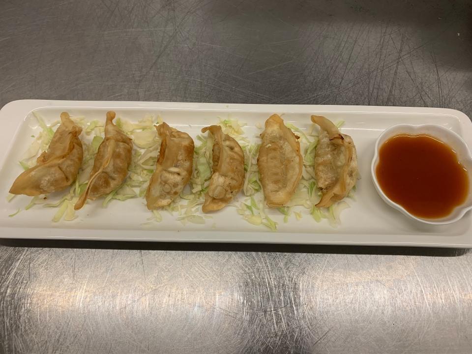 Crispy Chicken Gyoza · Deep fried dumpling filled with ground chicken and assorted vegetables. Served w/ homemade tamarind dipping sauce.
